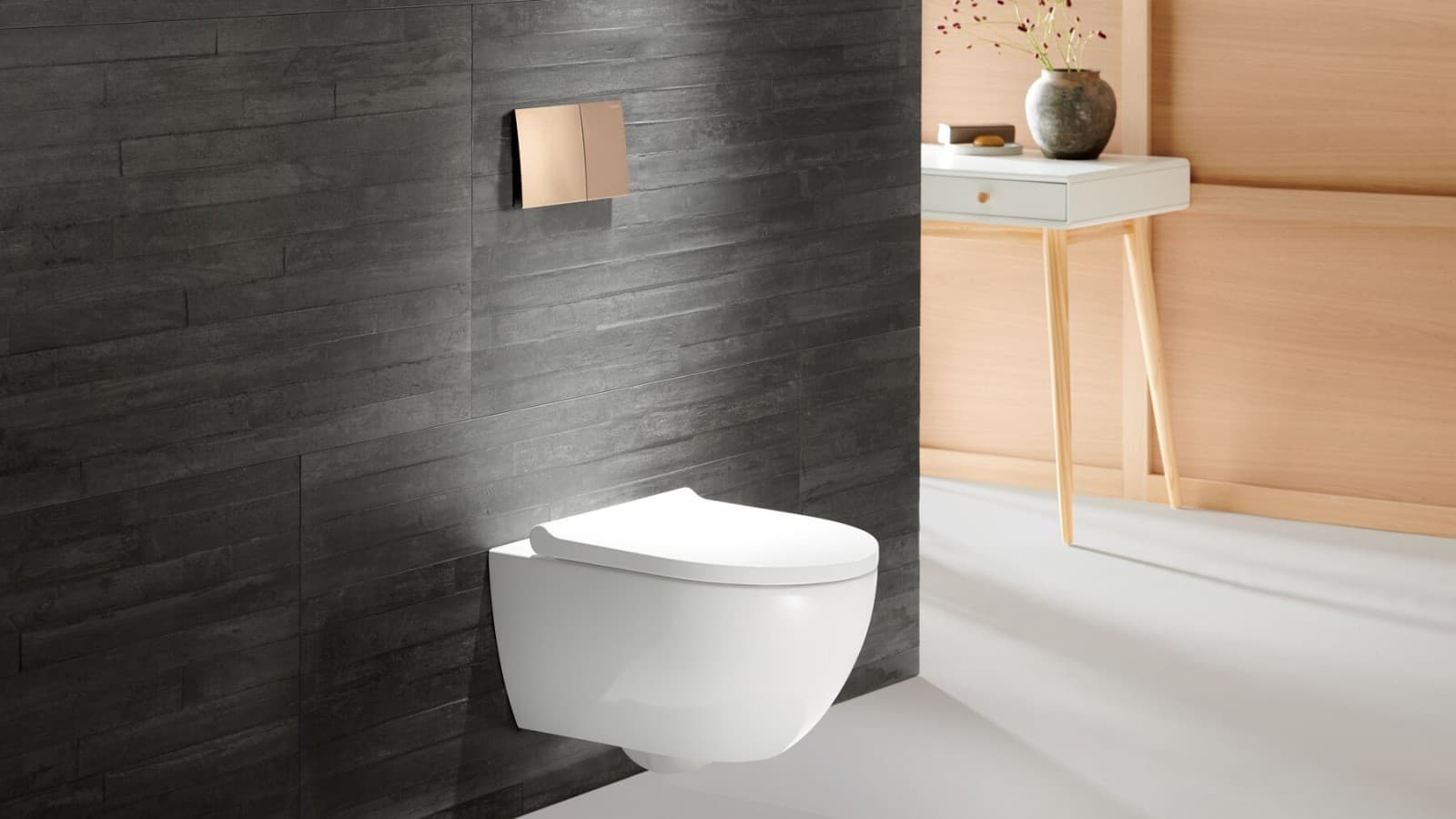 WC Geberit Acanto avec plaque de déclenchement Geberit Sigma70 en or rose WC Geberit Acanto avec plaque de déclenchement Geberit Sigma70 en or rose