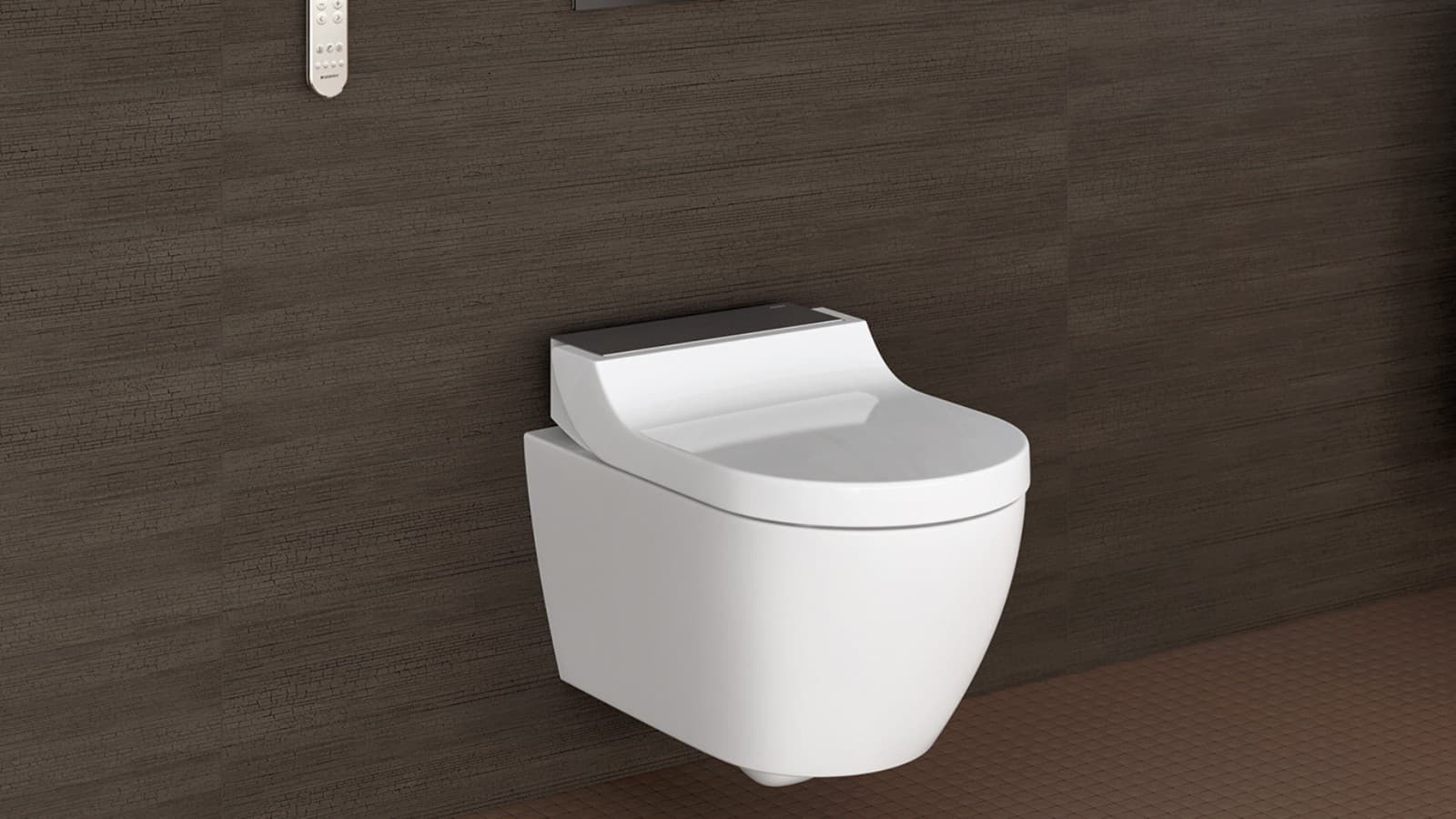 Toilettes avec douchette Geberit AquaClean Tuma Comfort et lunette de WC chauffante Toilettes avec douchette Geberit AquaClean Tuma Comfort et lunette de WC chauffante